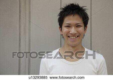 Stock Photography - Portrait of a young man smiling. Fotosearch