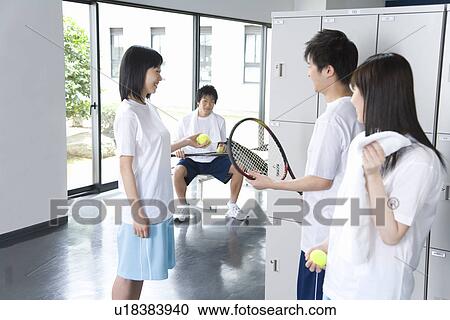 Four teenagers in gym clothes holding tennis balls and rackets in locker room View Large Photo Image Stock Image - Four teenagers in gym clothes holding tennis balls and rackets in locker room. Fotosearch