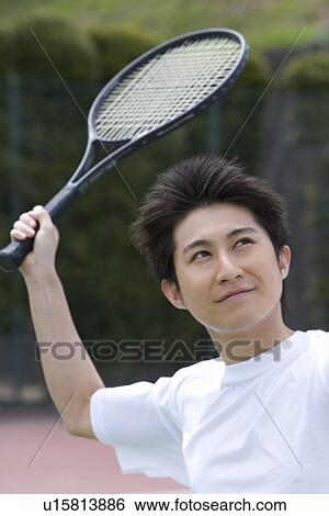 Stock Photograph - High School Boy Playing Tennis. Fotosearch