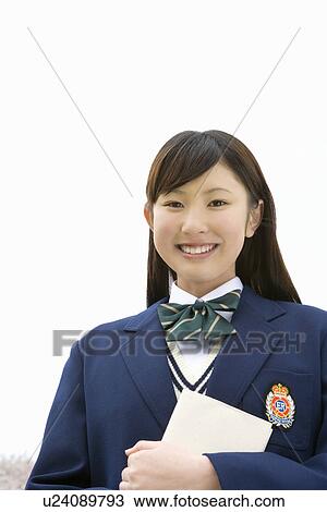 High School Girl Holding Book and Looking at Camera View Large Photo Image Stock Image - High School Girl Holding Book and Looking at Camera. Fotosearch