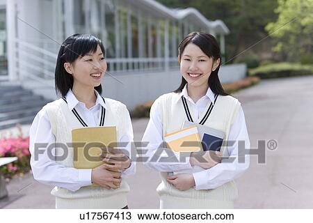 High School Girls Holding Books View Large Photo Image Stock Image - High School Girls Holding Books . Fotosearch