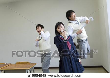 Three high school students practicing stage performance, blurred motion View Large Photo Image Stock Photo - Three high school students practicing stage performance, blurred motion. Fotosearch