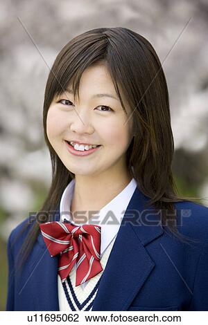 Stock Image - High School Students Looking at Mobile Phone. Fotosearch