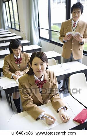 High School Boy Standing and Reading Textbook View Large Photo Image Stock Photography - High School Boy Standing and Reading Textbook. Fotosearch