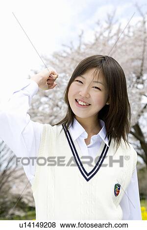 High School Girl In Front Of Cherry Blossoms View Large Photo Image Stock Photo - High School Girl In Front Of Cherry Blossoms. Fotosearch