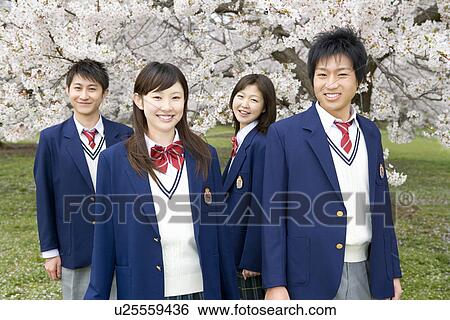 Stock Photograph - High School Student In Grass Field. Fotosearch