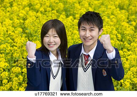 Stock Image - High School Students In Rape Seed Blossom Field. Fotosearch