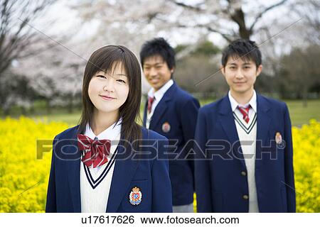 Stock Photograph - High School Students in Rape Seed Blossoms, Differential Focus. Fotosearch
