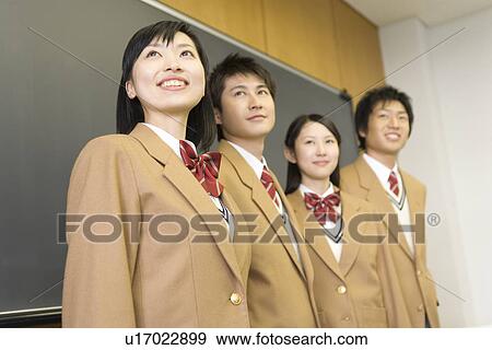 High School Students Standing and Smiling in front of Blackboard, Selective Focus View Large Photo Image Stock Photo - High School Students Standing and Smiling in front of Blackboard, Selective Focus. Fotosearch