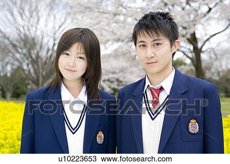 Stock Image - Portrait of High School Students in Rape Seed Flowers. Fotosearch