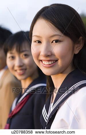 Portrait of teenager girls smiling and looking at camera View Large Photo Image Stock Photo - Portrait of teenager girls smiling and looking at camera. Fotosearch