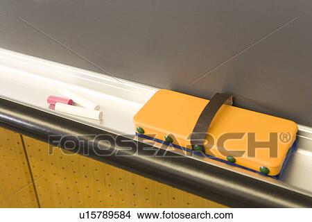 Picture - Chalks and eraser on blackboard. Fotosearch