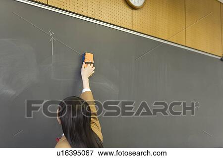 High School Student Erasing Blackboard View Large Photo Image Stock Photo - High School Student Erasing Blackboard. Fotosearch