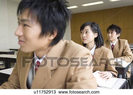 Stock Image - High School Students Listening Lecture, Selective Focus. Fotosearch