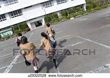 High School Students Running on School Ground View Large Photo Image Stock Photo - High School Students Running on School Ground. Fotosearch