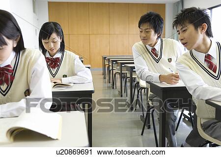 High school students sitting at desk in class View Large Photo Image Stock Image - High school students sitting at desk in class. Fotosearch