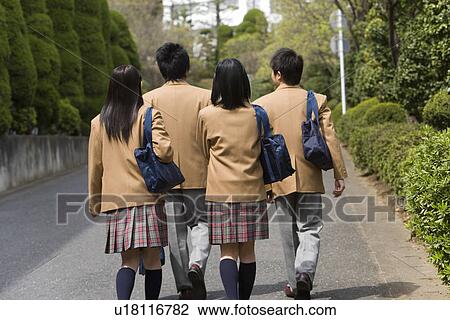Stock Image - High School Students Walking on Street Together. Fotosearch