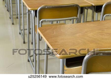 School Desks And Chairs In Empty Classroom Stock Photo U25256149