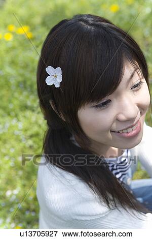 High angle view of a woman with a cherry flower head on her hair, Japan View Large Photo Image Stock Photo - High angle view of a woman with a cherry flower head on her hair, Japan. Fotosearch