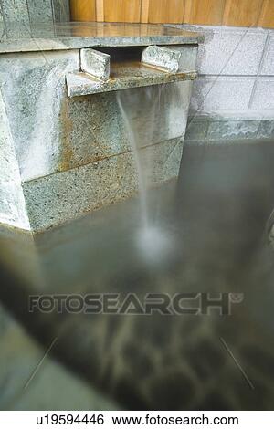 Hot water running out from a stone tap, hot spring, side view, differential focus, Japan View Large Photo Image Stock Photograph - Hot water running out from a stone tap, hot spring, side view, differential focus, Japan. Fotosearch