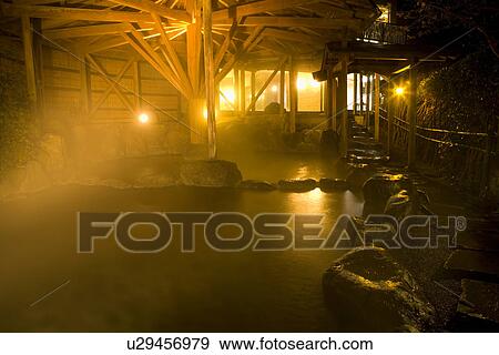 Stock Photo - Japanese common tub in the night, hot spring, high angle view, lens flare, Japan. Fotosearch