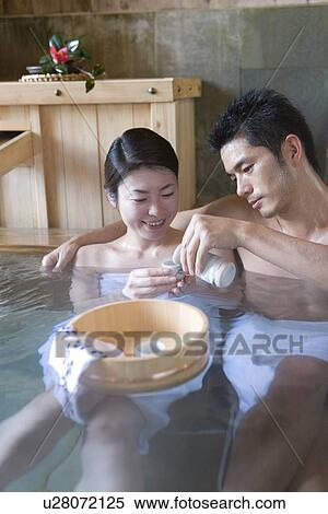 Japanese couple enjoying Sake in a hot tub, front view, Japan View Large Photo Image Stock Photography - Japanese couple enjoying Sake in a hot tub, front view, Japan. Fotosearch