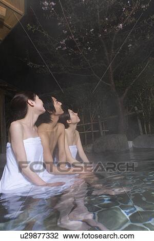 Man and women in hot tub looking up the sky, side view, Japan View Large Photo Image Stock Image - Man and women in hot tub looking up the sky, side view, Japan. Fotosearch