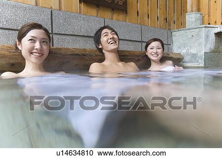 Man and women relaxing in hot tub, smiling, side view, Japan View Large Photo Image Stock Image - Man and women relaxing in hot tub, smiling, side view, Japan. Fotosearch