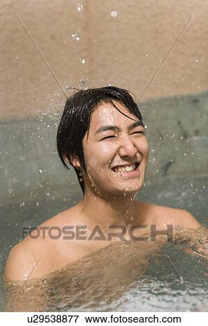 Man in hot tub, smiling, front view, Japan View Large Photo Image Stock Photo - Man in hot tub, smiling, front view, Japan. Fotosearch