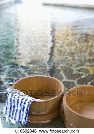 Stock Photograph - Towel on a wooden tub, hot spring, high angle view, Japan. Fotosearch