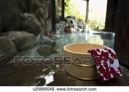Stock Photo - Towel on a wooden tub, hot spring, close up, Japan. Fotosearch