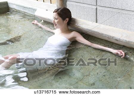 Woman relaxing in hot tub, side view, Japan View Large Photo Image Stock Photography - Woman relaxing in hot tub, side view, Japan. Fotosearch