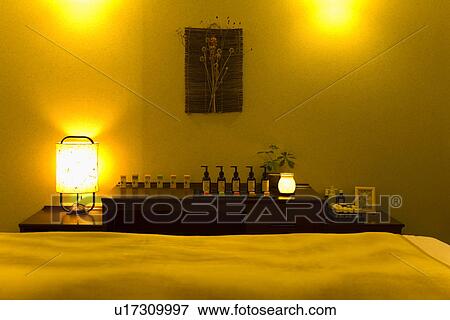 Stock Photo - Bottles of aromatherapy oil in the beauty salon, front view, Japan. Fotosearch