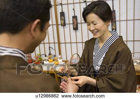Mature Adult Couple in Yukata Choosing Souvenirs, Rear View, Front View, Waist Up View Large Photo Image Stock Image - Mature Adult Couple in Yukata Choosing Souvenirs, Rear View, Front View, Waist Up. Fotosearch