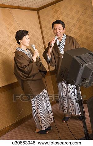 Mature Adult Couple Singing Together, Side View, Full Length View Large Photo Image Stock Photograph - Mature Adult Couple Singing Together, Side View, Full Length. Fotosearch