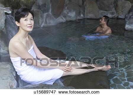 Mature Adult Couple Taking a Hot Spring Bath Together, Side View, Full Length, Head and Shoulder View Large Photo Image Stock Photo - Mature Adult Couple Taking a Hot Spring Bath Together, Side View, Full Length, Head and Shoulder. Fotosearch