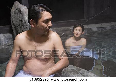Stock Photography - Mature Adult Couple Taking a Hot Spring Bath Together, Front View, Waist Up, Head and Shoulder. Fotosearch