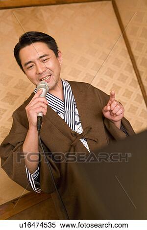 Mature Adult Man in Yukata Singing, Front View, Head and Shoulder View Large Photo Image Stock Photography - Mature Adult Man in Yukata Singing, Front View, Head and Shoulder. Fotosearch