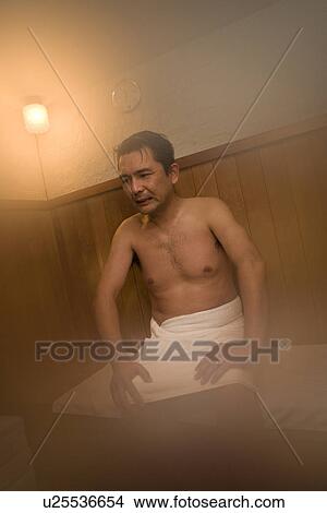 Picture - Mature Adult Man Taking a Sauna, Front View, Three Quarter Length. Fotosearch