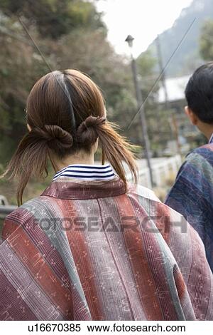 Rear View of a Young Adult Woman and a Mature Adult Man, Differential Focus View Large Photo Image Stock Photography - Rear View of a Young Adult Woman and a Mature Adult Man, Differential Focus. Fotosearch