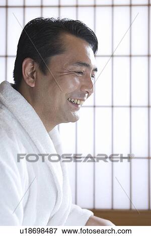 Stock Photo - Side View of a Mature Adult Man in a Bathrobe, Head and Shoulder. Fotosearch