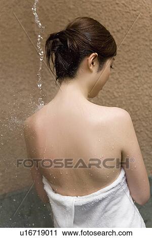 Woman standing under the hot tap, hot water dropping, rear view, Japan View Large Photo Image Stock Image - Woman standing under the hot tap, hot water dropping, rear view, Japan. Fotosearch