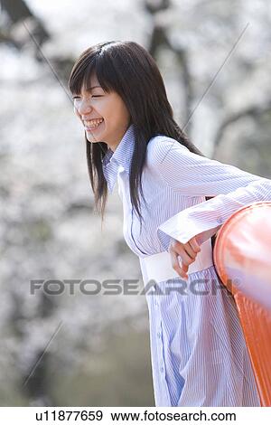 Young Woman Leaning on a Rail, Side View, Differential Focus View Large Photo Image Stock Photo - Young Woman Leaning on a Rail, Side View, Differential Focus. Fotosearch