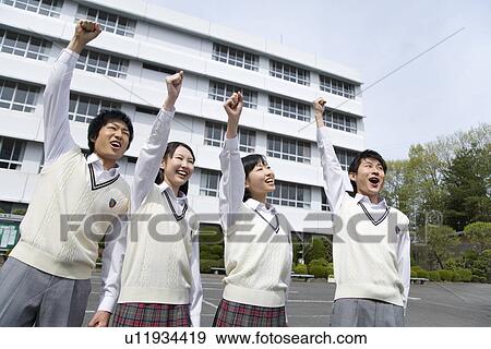 Four high school students smiling and punching air, side by side View Large Photo Image Stock Photo - Four high school students smiling and punching air, side by side. Fotosearch