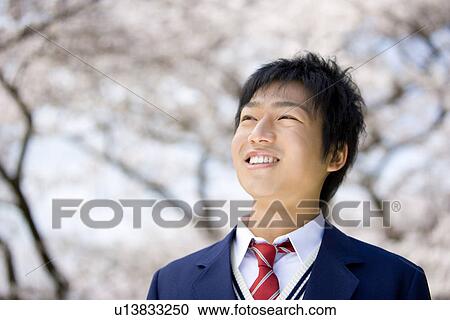 Stock Image - Four High School Students Walking Together on Sideway. Fotosearch