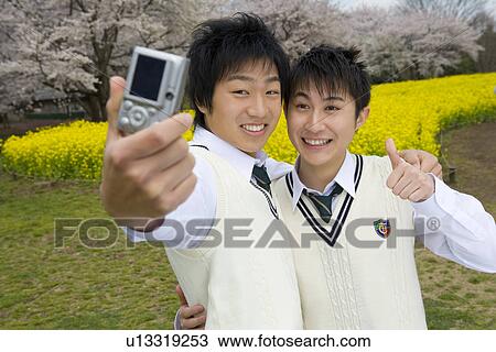 High School Boys Taking Pictures of Themselves View Large Photo Image Stock Image - High School Boys Taking Pictures of Themselves. Fotosearch