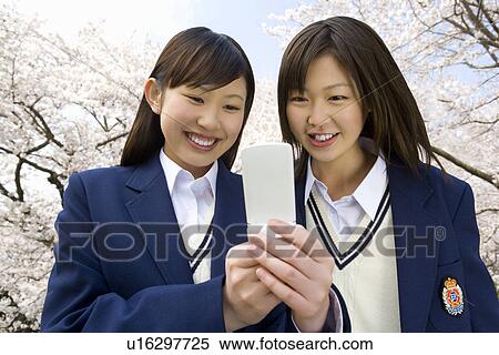 Stock Photography - High School Girl in Blazer with Holding Diploma. Fotosearch