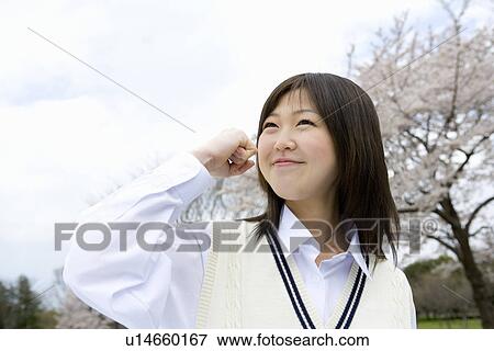 High School Girl In Front Of Cherry Blossoms View Large Photo Image Stock Photo - High School Girl In Front Of Cherry Blossoms. Fotosearch