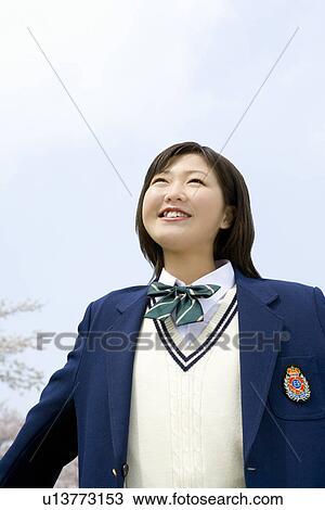 High School Girl Spreading Arms, Cherry Blossoms in the Background View Large Photo Image Stock Image - High School Girl Spreading Arms, Cherry Blossoms in the Background. Fotosearch