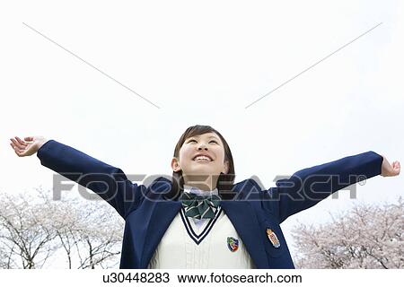 High School Girl Spreading Arms, Cherry Blossoms in the Background View Large Photo Image Stock Image - High School Girl Spreading Arms, Cherry Blossoms in the Background. Fotosearch
